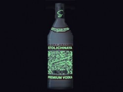When the lights go out, the bottle releases a radiant pattern using glow-in-the-dark ink.