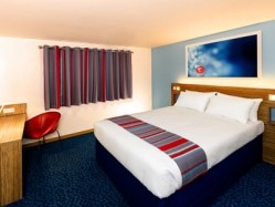 Travelodge's new style room which will feature in all its new-build hotels and will be present in 80 per cent of its hotels by the end of next year
