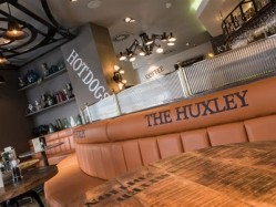 The Huxley will offer a range of gourmet hot-dogs and chuck steak burgers in a 'home-from-home' environment