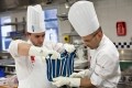 The team's practise sessions took place most weekends in a kitchen at the London outpost of training school Le Cordon Bleu - here Nicolas Belorgey and Javier Mercado practice pulled sugar ribbons.