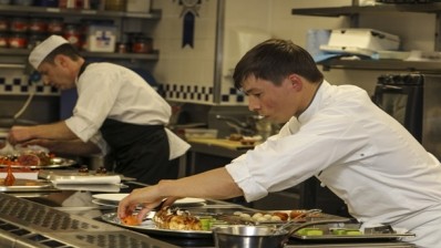 Grebenstein [front] cooks against chef Steve Love