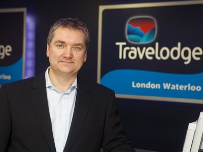 Grant Hearn will return to the role of chief executive of budget hotel firm Travelodge and Guy Parsons will now leave the company, it has been announced