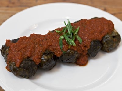 Koubebia, one of the four dishes created by Tonia Buxton for The Real Greek. The dish includes Cypriot dolmades with lamb & rice, which is wrapped in vine leaves and served warm with tomato sauce.