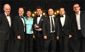 The Restaurant magazine team collect their award from comedian Sean Lock (far right)