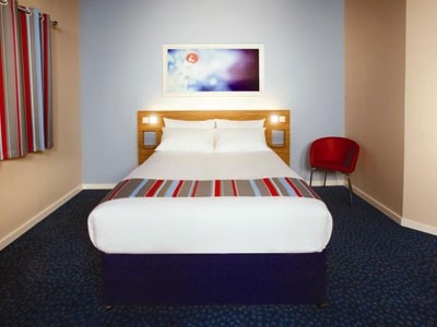 The company's new rooms feature a blue and red design and new, king-sized Travelodge Dreamer beds