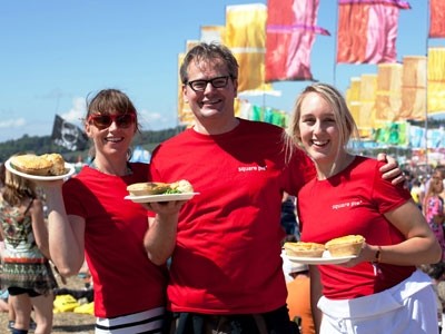 Square Pie's founder Martin Dewey with two of his operation team members at Glastonbury