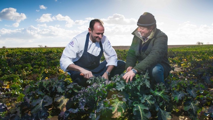 Teamwork: Daniel Smith (l) and Charlie Tacon survey the farmland