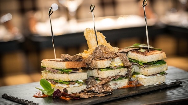 The Duck Club Sandwich with Crispy Asparagus and Celeriac with Truffle, Egg, Corn Crisp, Pomegranate and Fresh Truffle is one of the many truffle-focused dishes on the menu at Harrods' new restaurant Tartufi & Friends
