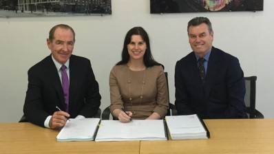 Eamonn Laverty of McAleer & Rushe signs the contract with Susan Cully and John Corless of Marlin Apartments 