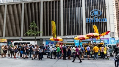 Queuing for a Halal Guys cart in New York