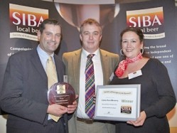 Colin Wilde (left) and Charlie Bromeley (right) of Castle Rock Brewery collected their Overall Winner award from SIBA chairman Keith Bott