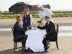 (L-R): Martin Lawrence - general manager of Marine Hotel; Andrew Beattie - head chef; Laura Ferrier - waitress; and Ryan James - owner of Two Fat Ladies Group, with The Marine Hotel in the background