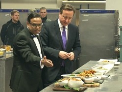 Enam Ali, founder of the British Curry Awards, gave David Cameron a tour the kitchen before the ceremony began