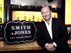 Mark McQuater with the newly-designed Smith & Jones logo 