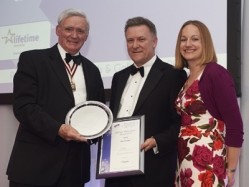 Late master at Worshipful Company of Cooks Bev Puxley recieves his Lifetime Achievement Award from national chair of PACE Geoff Booth and national business development manager at Lifetime Awarding Lisa Hibbard