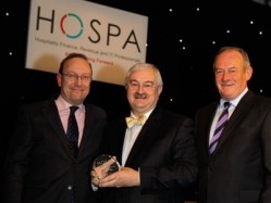 Russell Kett, the managing director of HVS London, collects a Lifetime Achievement Award from HOSPA