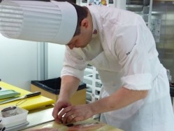 Adam Bennett, head chef at Simpsons in Edgbaston, Birmingham, preparing chicken for the award-winning meat platter from the UK team which came sixth at the European final of the Bocuse d'Or in Brussels