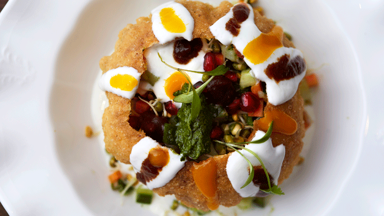 Raj-Kachori-–-crisp-pastry-shell-filled-with-sprouted-mung,-fenugreek,-pickled-kachumber-and-spiced-yoghurt-(v)-close-up